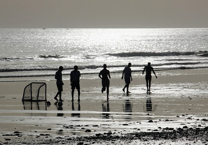 a casual beach football game