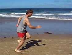 running in the sand at the beach