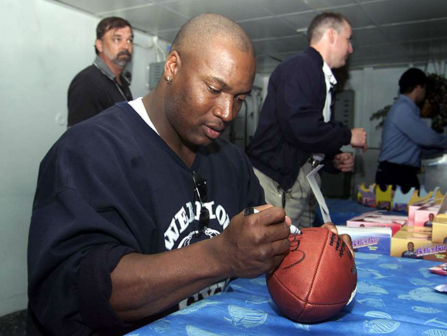 Bo Jackson signing a football