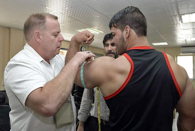 measuring flexed biceps girth 