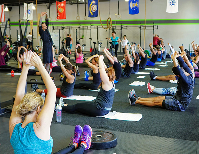 personal trainer helping a client