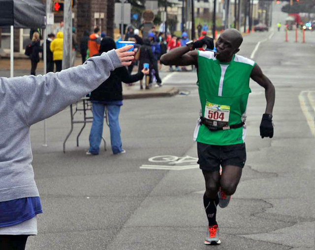 runner getting a drink