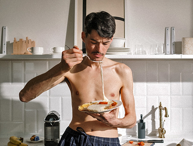 skinny man eating meal