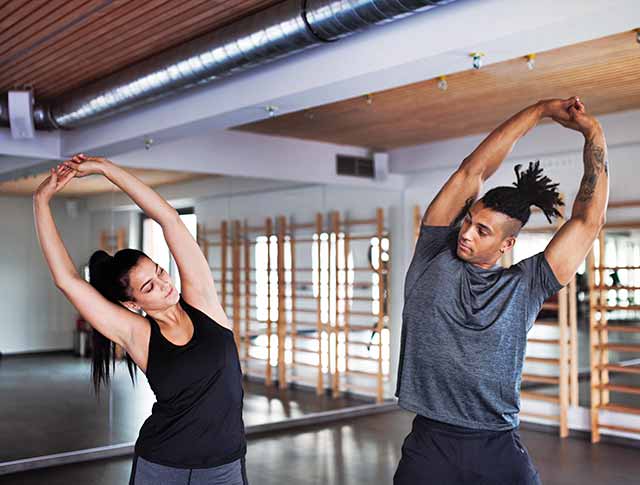 Personal trainer helping a client